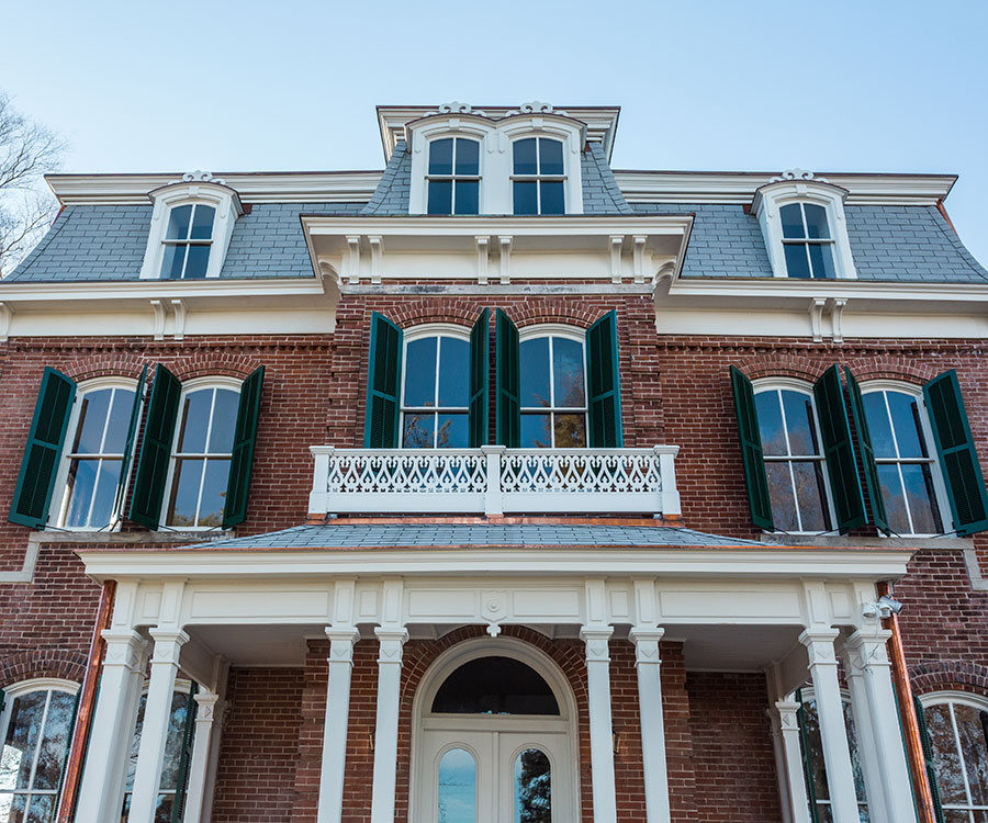 Henry Blosser House column around front porch with brick exterior